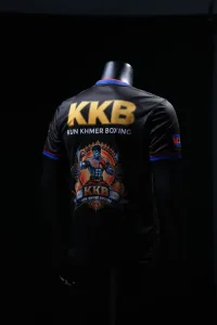 Back view of the official KKB Kun Khmer jersey with large gold KKB identity and fighter artwork