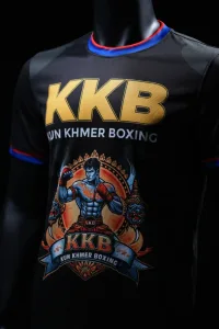 Front view of the official black KKB Kun Khmer training jersey with gold KKB lettering